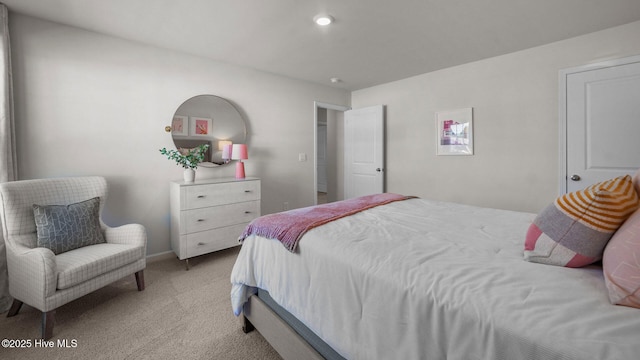 bedroom with light colored carpet