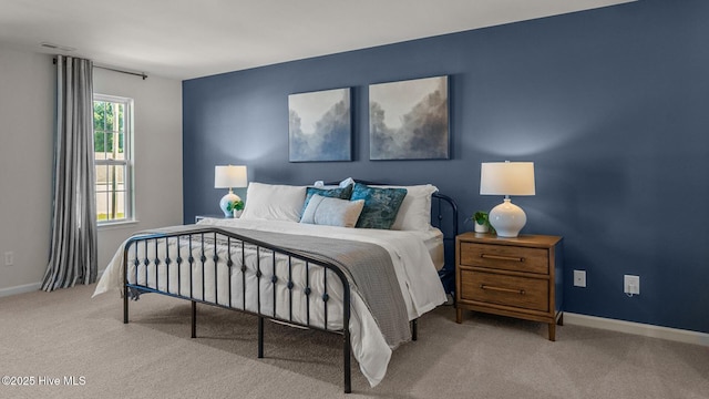 bedroom featuring light colored carpet