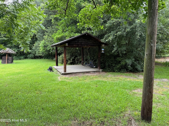 view of yard featuring a gazebo and a wooden deck