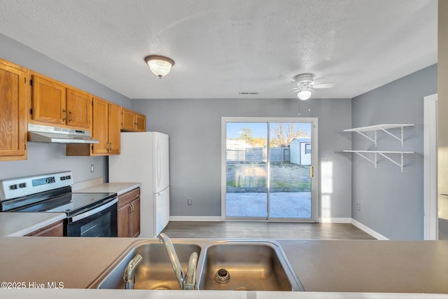 kitchen with ceiling fan, electric stove, a textured ceiling, and white refrigerator