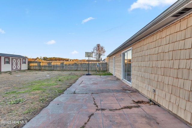 view of patio / terrace featuring a storage shed