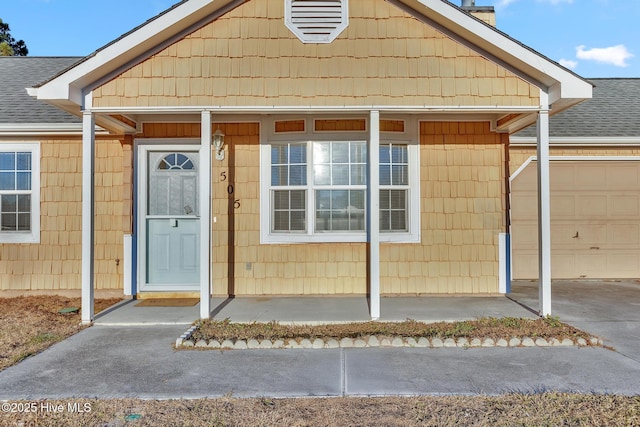 view of exterior entry featuring a garage