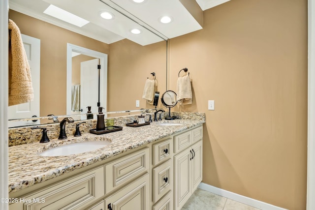 bathroom featuring vanity, tile patterned flooring, and crown molding