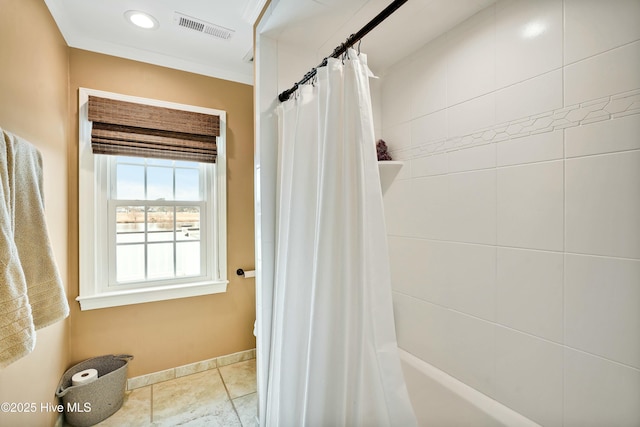 bathroom featuring ornamental molding, tile patterned flooring, and shower / bath combo with shower curtain