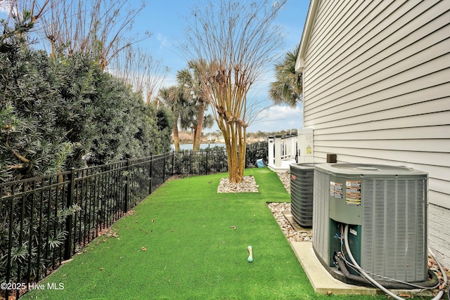 view of yard with central air condition unit