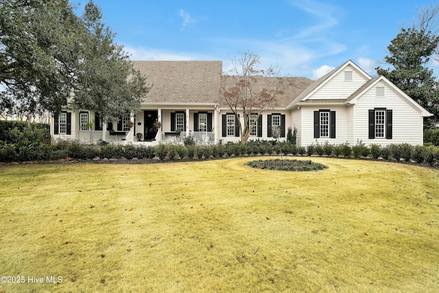 view of front of home with a porch and a front lawn