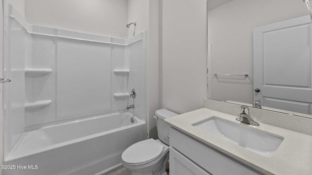 full bathroom featuring bathtub / shower combination, vanity, and toilet