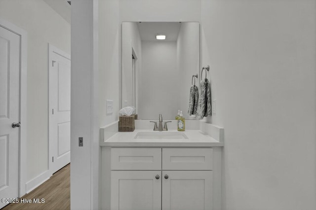 bathroom with vanity and wood-type flooring