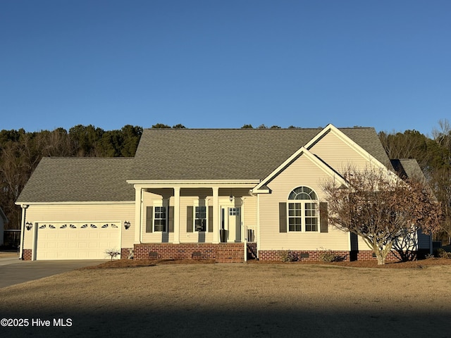 view of front of home with a garage and a front lawn