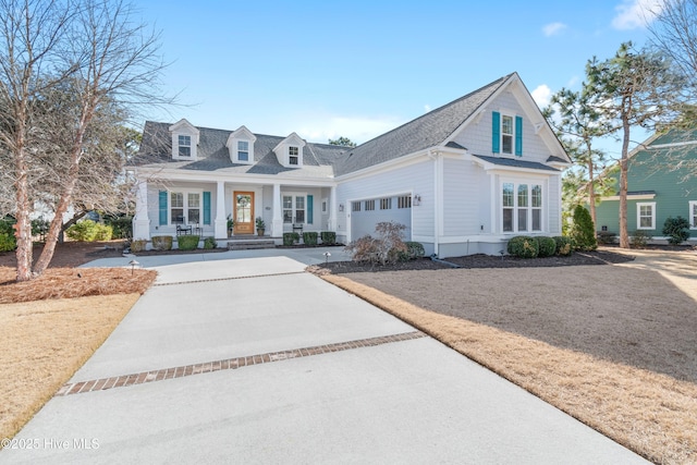 view of front of house featuring a garage and covered porch