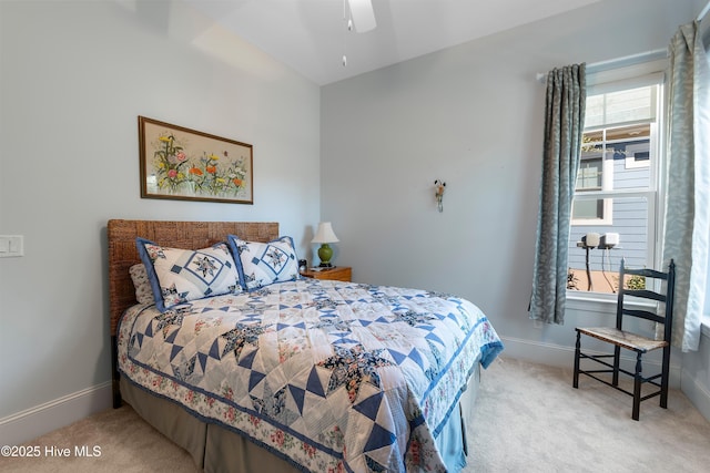 bedroom with ceiling fan, multiple windows, and light carpet