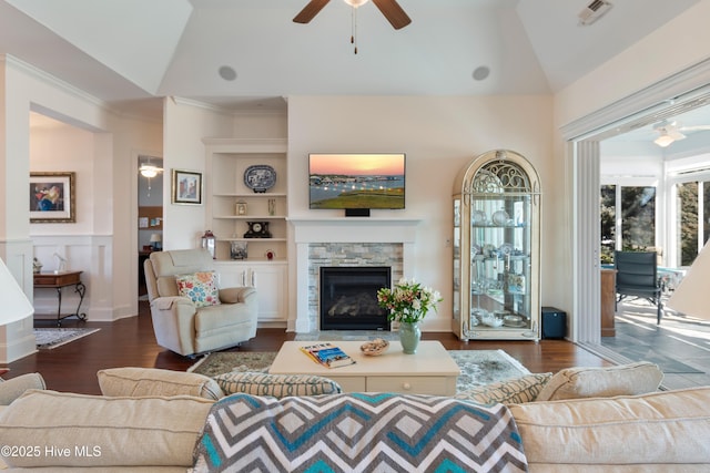 living room with dark wood-type flooring, ceiling fan, and lofted ceiling