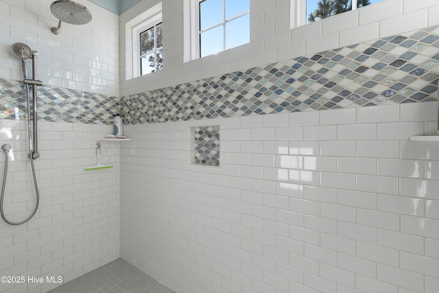 bathroom featuring a tile shower