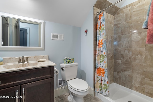 bathroom with vaulted ceiling, tile patterned flooring, vanity, toilet, and a shower with shower curtain