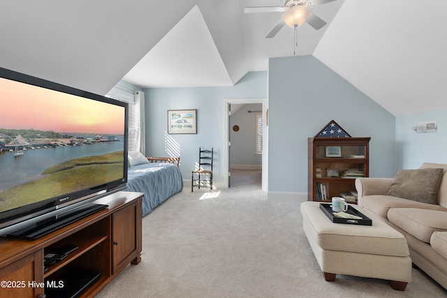 bedroom featuring vaulted ceiling, light colored carpet, and ceiling fan