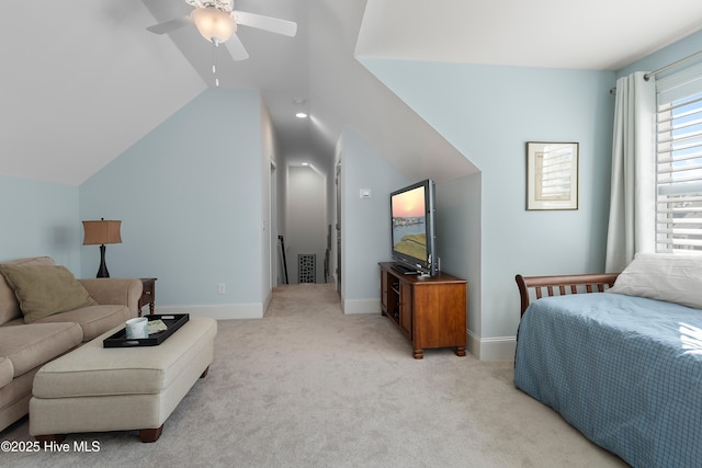 carpeted bedroom with vaulted ceiling and ceiling fan