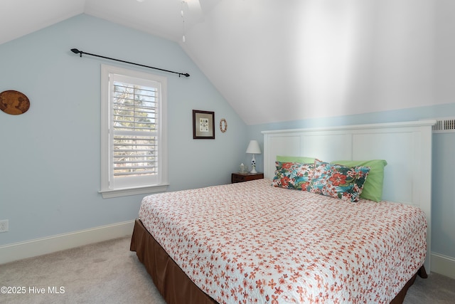 carpeted bedroom with vaulted ceiling