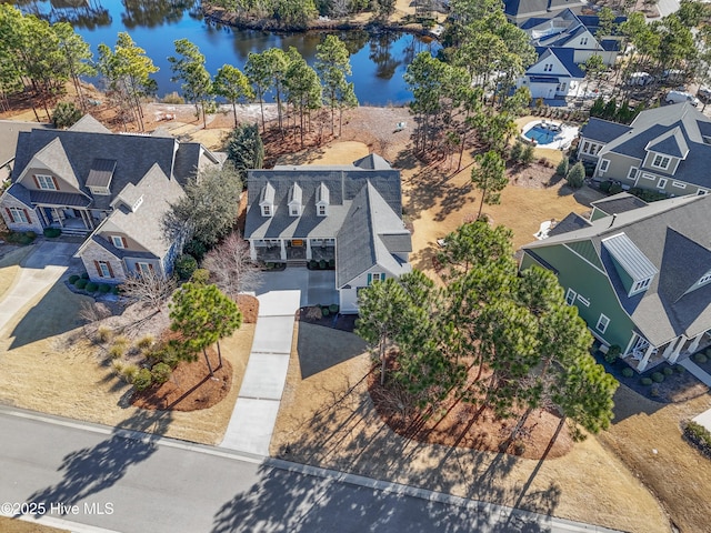 birds eye view of property featuring a water view