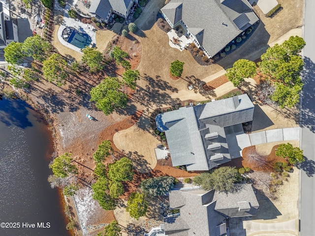 birds eye view of property with a water view