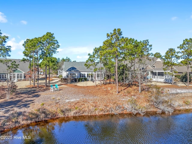 back of house featuring a water view