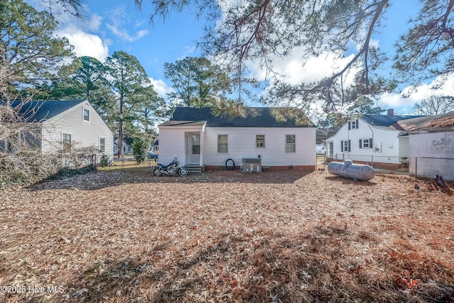 rear view of house with cooling unit