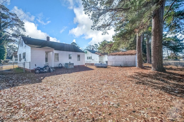 back of property featuring central air condition unit