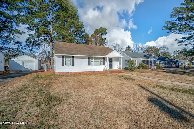 ranch-style house with an outbuilding, a garage, and a front yard