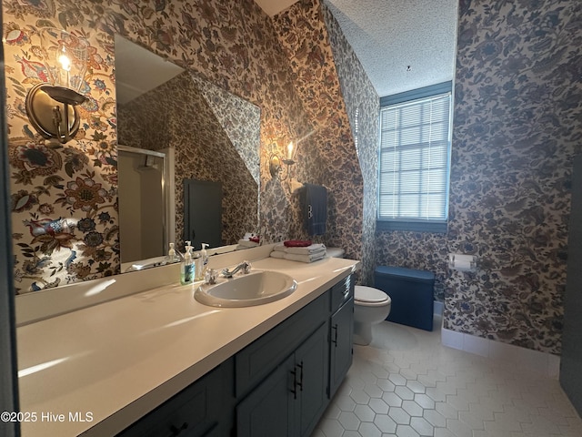 full bath featuring wallpapered walls, toilet, tile patterned floors, a textured ceiling, and vanity