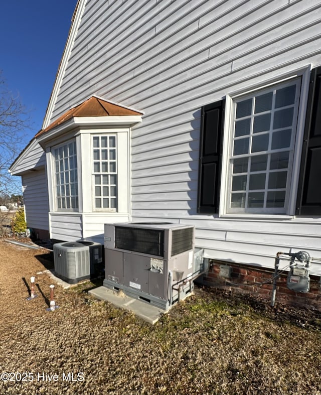 view of side of property featuring cooling unit