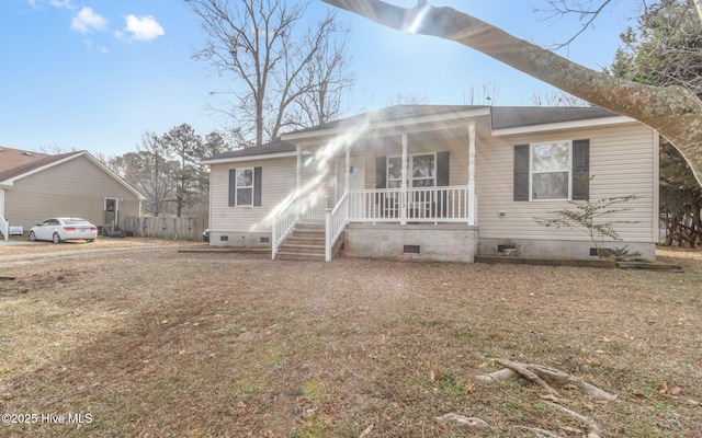 view of front facade with a porch and a front lawn