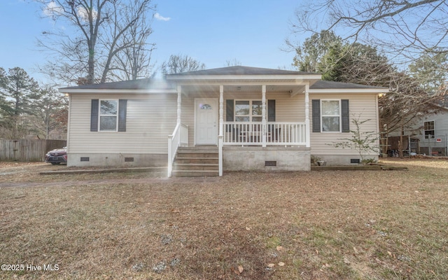 view of front of home featuring covered porch and a front yard