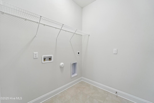 clothes washing area with hookup for a washing machine, gas dryer hookup, and hookup for an electric dryer