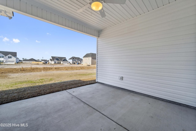 view of patio featuring ceiling fan