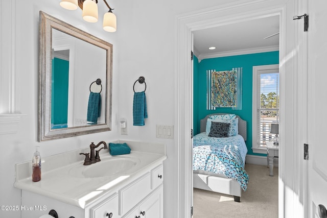 bathroom with crown molding and vanity