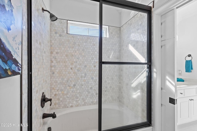 bathroom featuring vanity and combined bath / shower with glass door