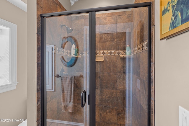 bathroom featuring an enclosed shower