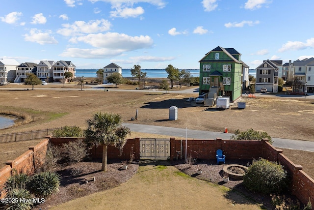 view of yard with a playground and a water view