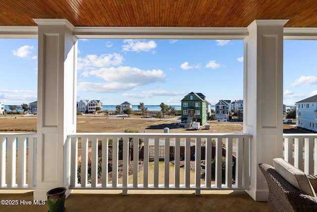 balcony featuring a water view