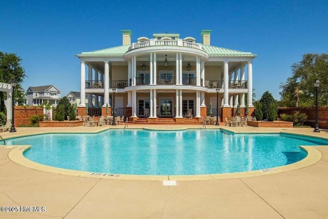 view of pool featuring a patio area