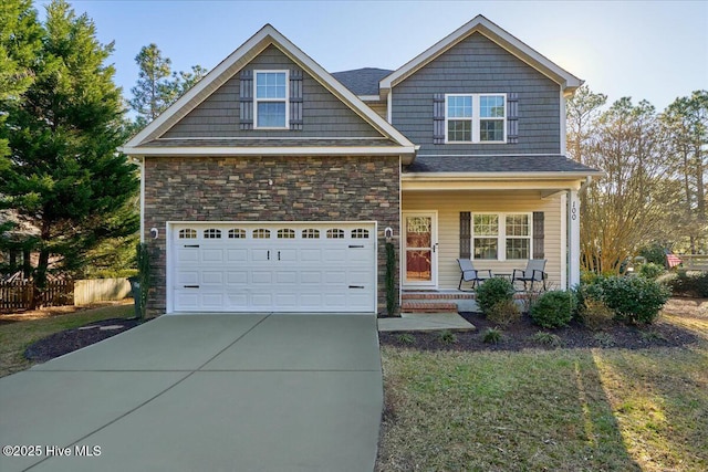 view of front facade featuring a garage and covered porch