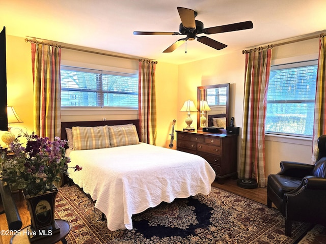 bedroom with ceiling fan and hardwood / wood-style floors