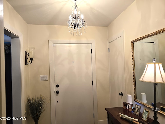 foyer entrance with an inviting chandelier