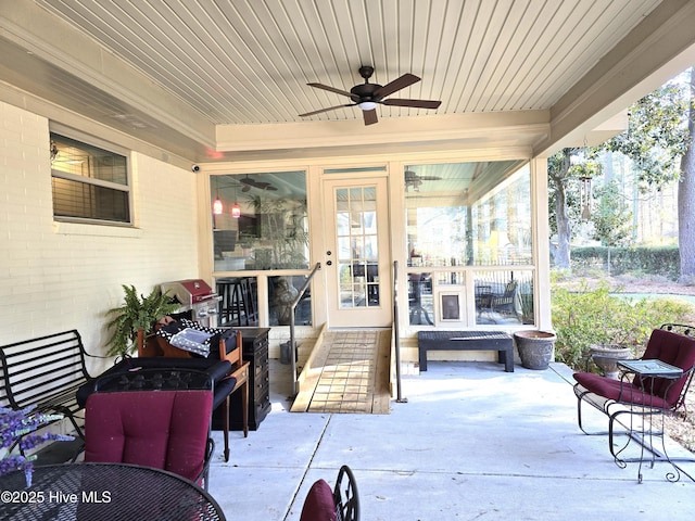 exterior space with ceiling fan