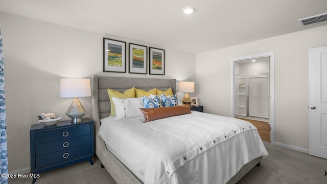 carpeted bedroom featuring a walk in closet and a closet