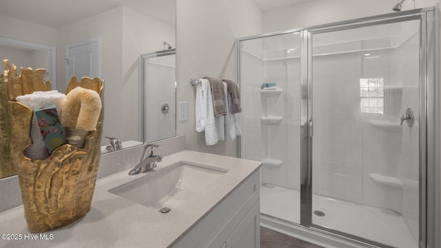 bathroom with vanity and an enclosed shower