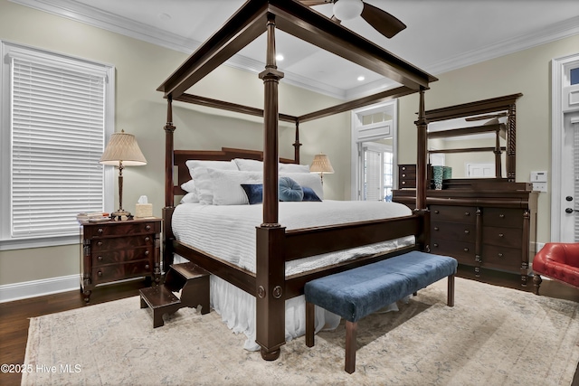 bedroom with ceiling fan, beam ceiling, dark wood-type flooring, and crown molding