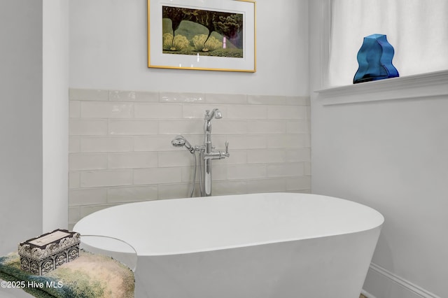 bathroom with a tub to relax in