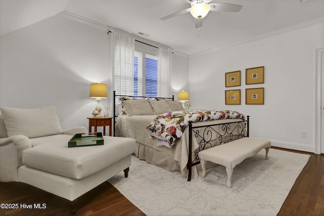 bedroom featuring ceiling fan, wood-type flooring, and crown molding