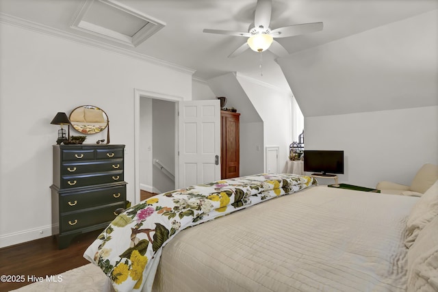 bedroom featuring vaulted ceiling, ceiling fan, dark hardwood / wood-style flooring, and ornamental molding