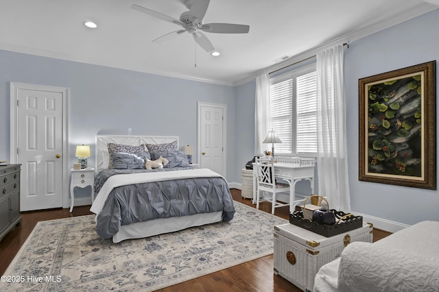 bedroom featuring ceiling fan, dark wood-type flooring, and ornamental molding